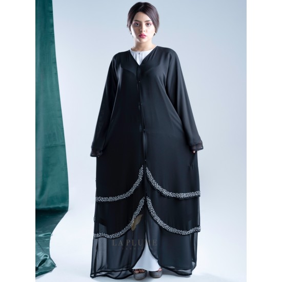 AK3013 Chiffon Abaya with black and white sides with hand work its three layers. Curve from the front and arrow from the back. The sleeve is French