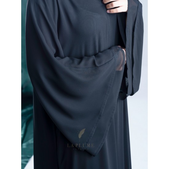 AK3013 Chiffon Abaya with black and white sides with hand work its three layers. Curve from the front and arrow from the back. The sleeve is French