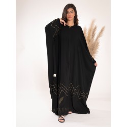 AK3017 Bisht abaya with a royal black crepe fabric, with consistent golden wavy lines at the bottom and on the sleeves with a very comfortable round neck