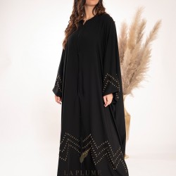 AK3017 Bisht abaya with a royal black crepe fabric, with consistent golden wavy lines at the bottom and on the sleeves with a very comfortable round neck