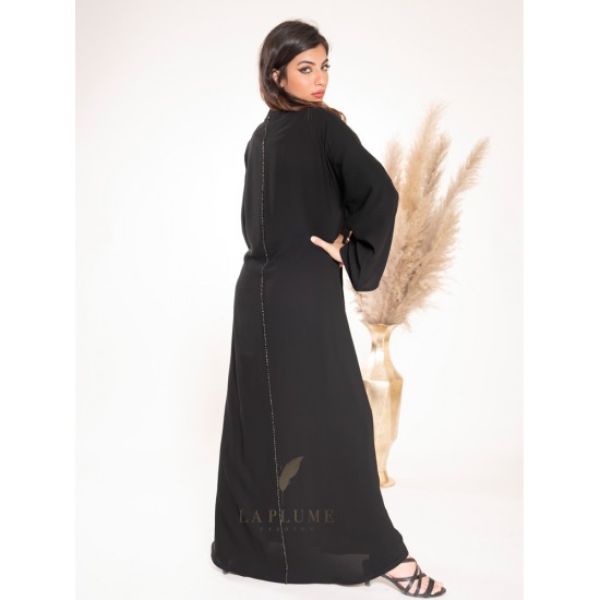 AK3022 Royal black crepe abaya with a calm and sophisticated design, with two lines x on the sleeves and line x from top to bottom from behind the center of the abaya