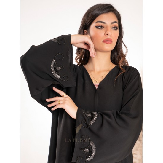 AK3028 Black crepe abaya with a v neck hand work from bottom to top in the middle behind the abaya and on the sleeves